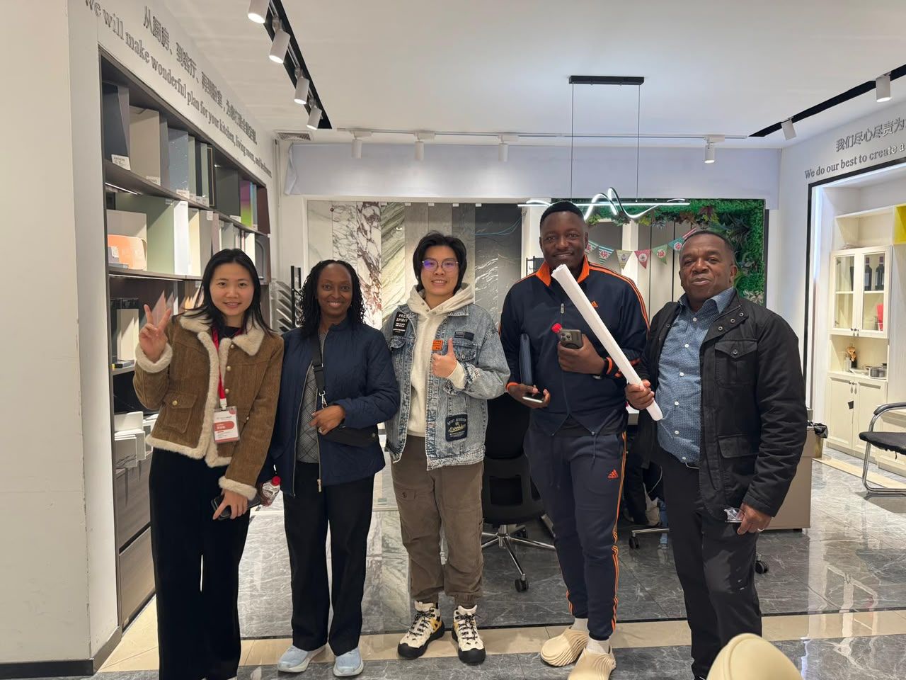 Vakanesu team at an interiors showroom viewing kitchen and surface samples