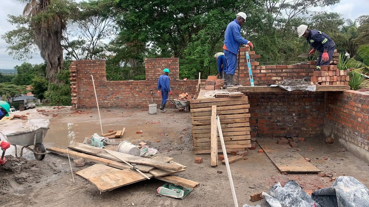 Bricklaying team on an upper floor